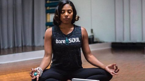 BareSoul founder Ashley Williams practices mindfulness and meditates during a yoga session. BareSoul will be in Foster to conduct yoga on March 7.