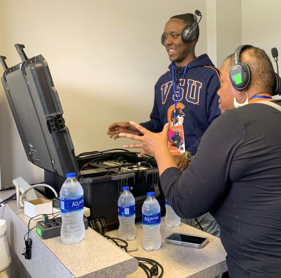 Jaylen Cofield learns how to operate a control board in the press box at Rogers Stadium. Contributed photo by Professor Antoine Williams.