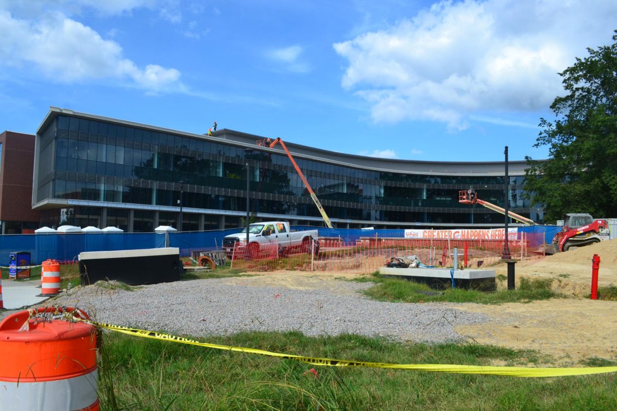 The Academic Commons building remains under construction but the exterior is complete and plans are for it to open in Fall 2025.