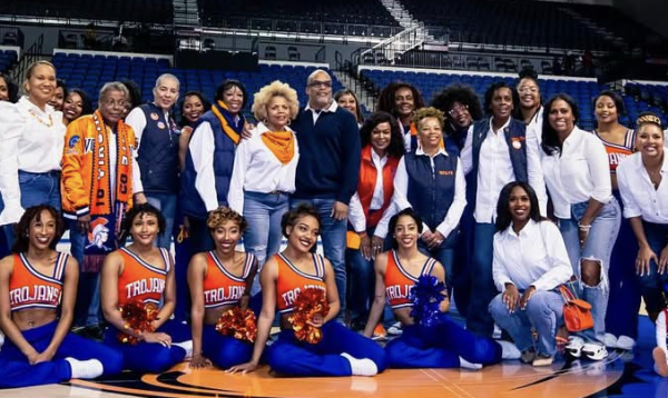 Paulette Walker Johnson, founder of the Woo Woos, stands with generations of Woo Woos from 1974 to the present, showcasing the enduring legacy of empowerment, leadership, and community spirit. Contributed photo.