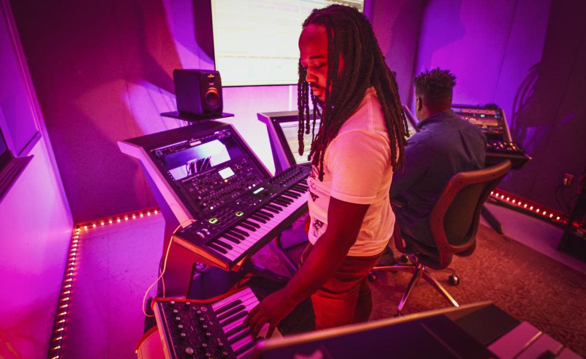 Marvin Leach plays a song on the keyboard while testing out the recording studio in Davis Hall. The music production technology students have several areas in Davis Hall dedicated to the recording process. Contributed photo. 
