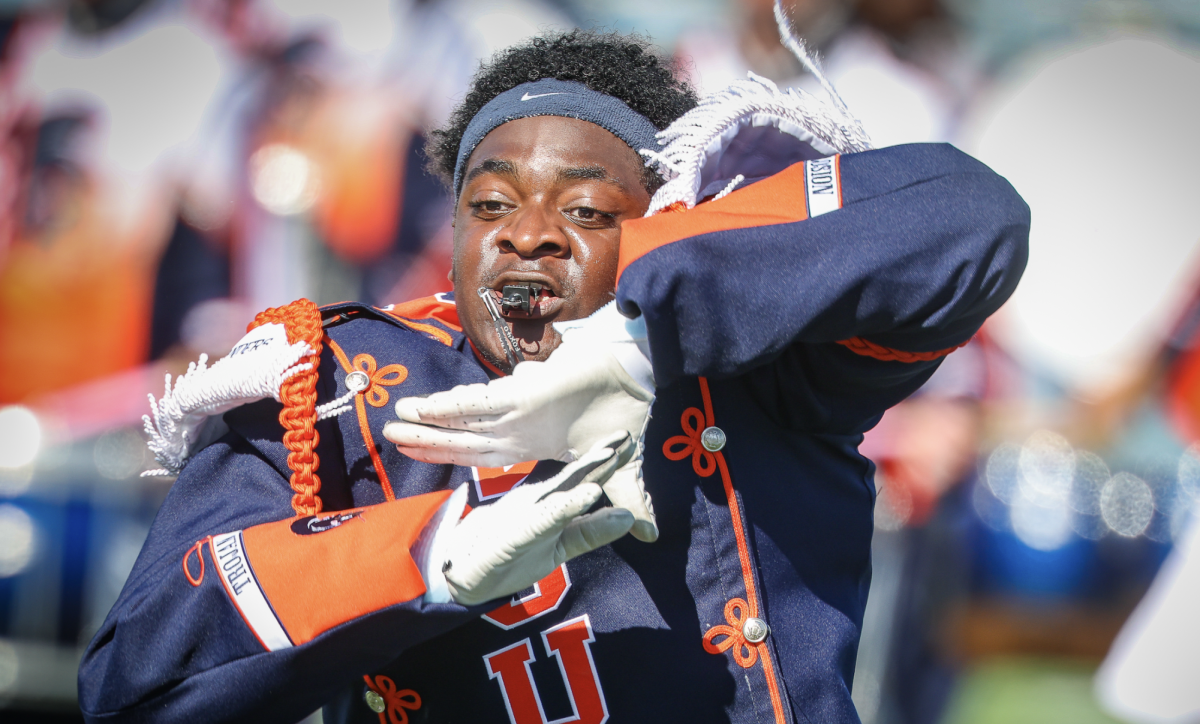 Drum Major Lajohn Plummer entertains the crowd at the halftime show by the Trojan Explosion on Saturday, Oct. 4.
