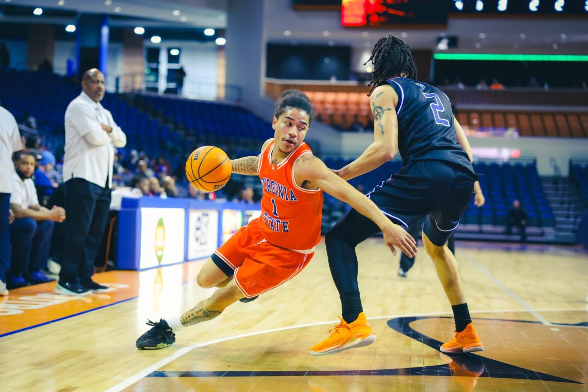 Guard Jacob Cooper finds his way to the basket around a defender in the match against Fayetteville State University. Contributed photo.