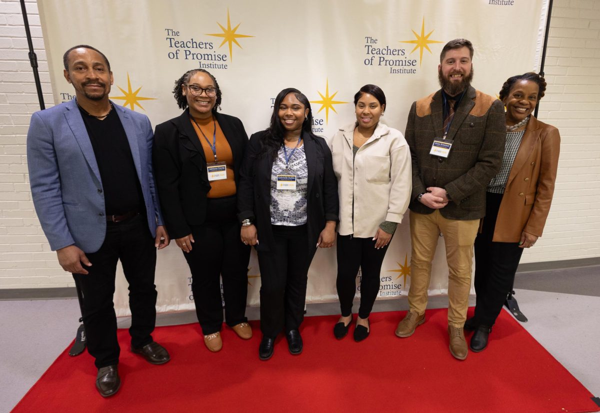(Left to right) Dr. Lashawn McNeil, senior Adriana Young, senior Gabrielle Ruffin, senior Tysheera Saunders, senior Brian Kreemer, and Dr. Aretha McNeil take a photo during the first day of The Teachers of Promise Institute. 
