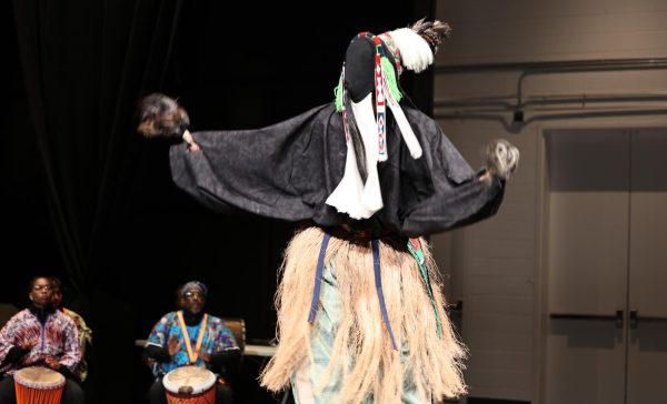 The Trojan Alliance Performing Arts or TAPA’s djembe drum battery, accompanied by a stilt walker, kicks off the theater takeover in the new Alfred Harris Academic Commons.