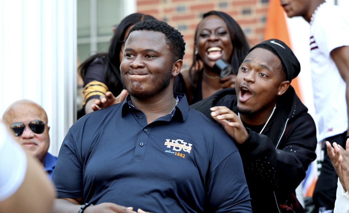 (Left to right) Zin Cambridge hears the results of the vote and is congratulated by Tobias Kargbo. The announcements were made on Thursday in front of Foster Hall as part of the Spring Fling events. 
